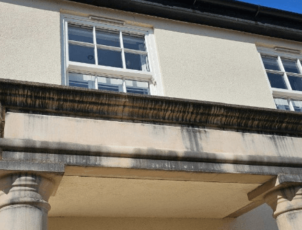 Exterior architectural stone before professional cleaning