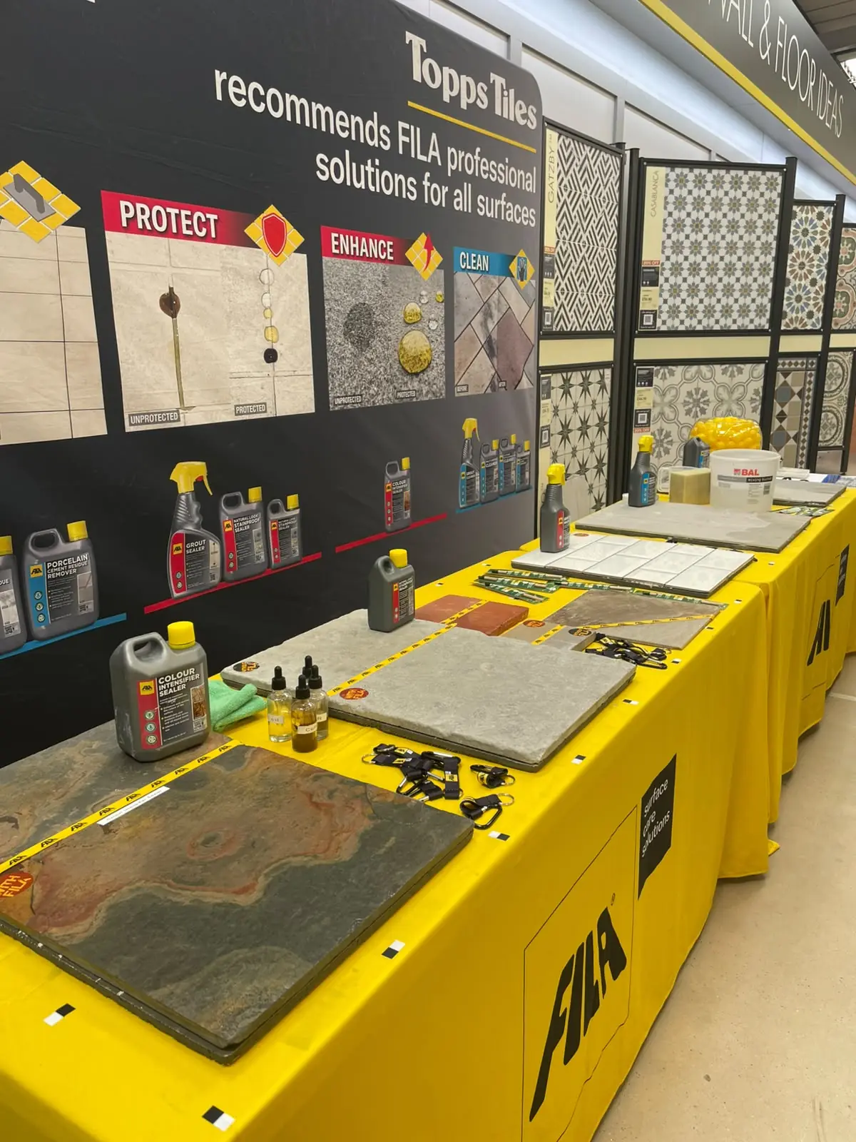 Fila stone-care product display with tile and natural stone samples