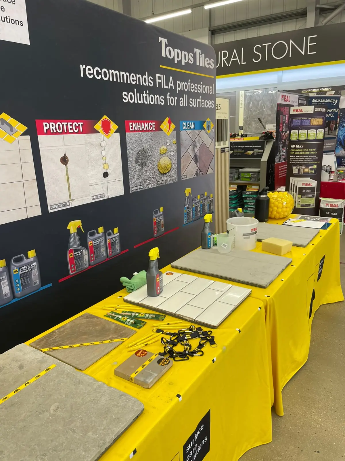Fila tile-protection products and treated stone samples on display