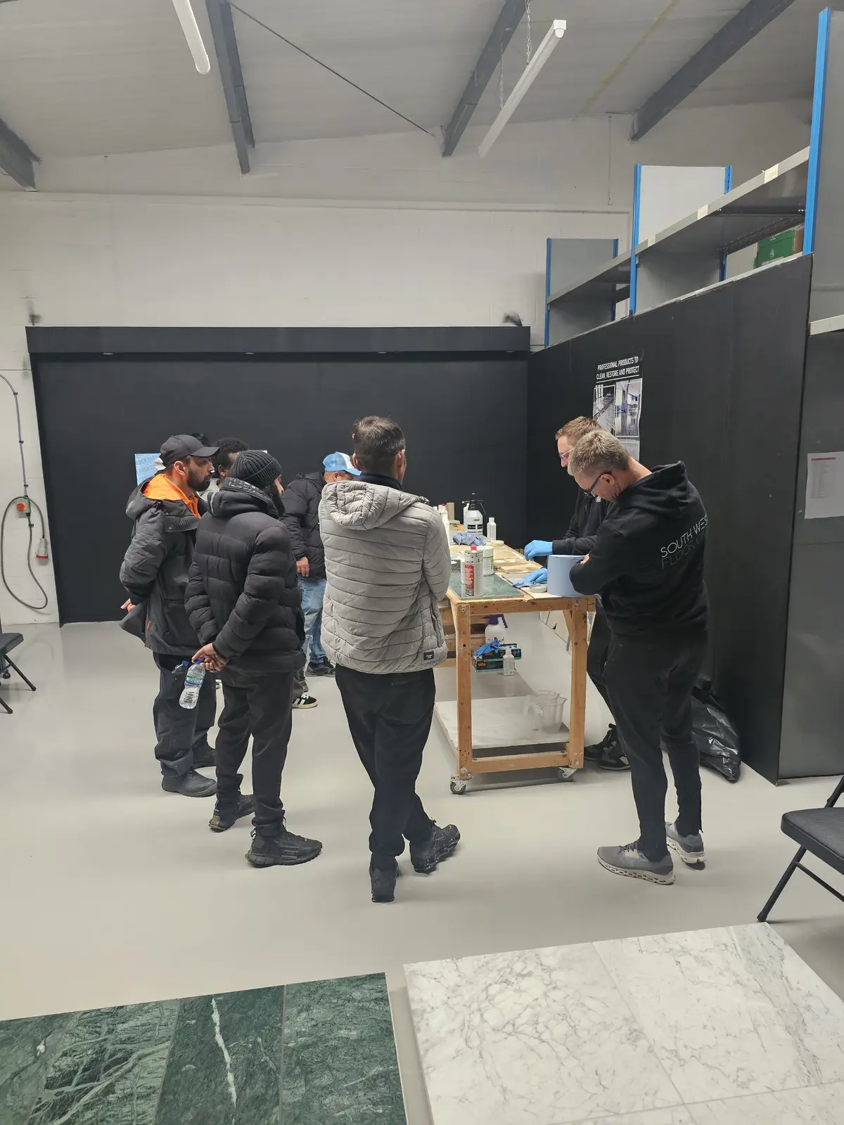 Practical stone treatment demonstration for training participants